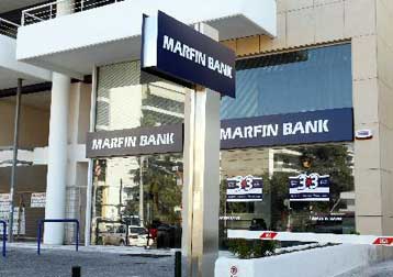 Η Μarfin Popular αυξάνει πρόβλεψη για τα κέρδη, αποκλείει συγχώνευση το 2007