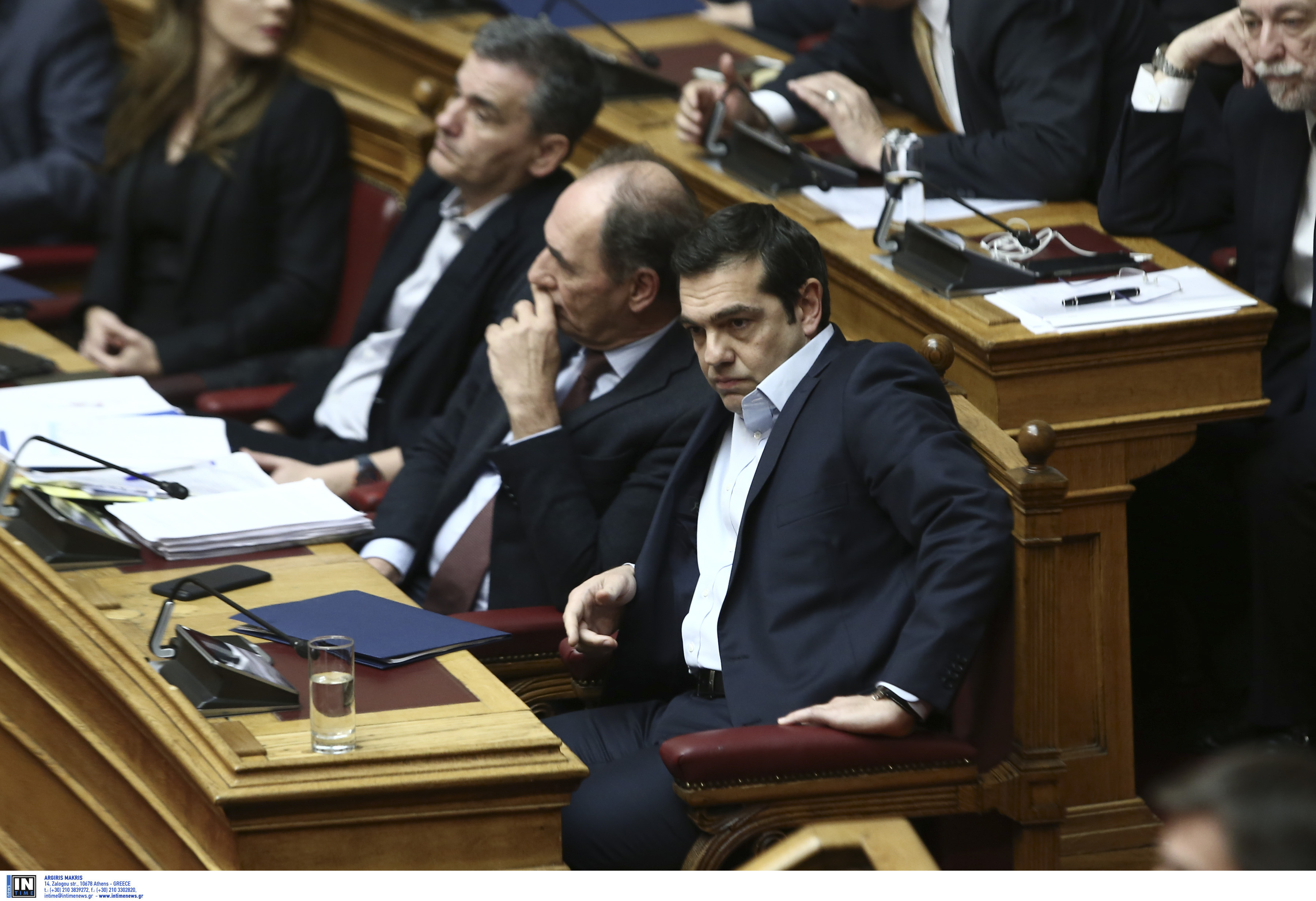 Under fire from right, left, Tsipras defends deal with creditors