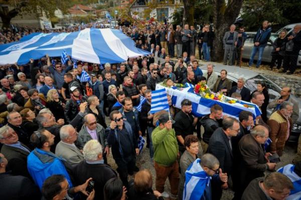 Thousands of mourners flock to Vouliarates, southern Albania for funeral of Greek shot dead by Special Forces