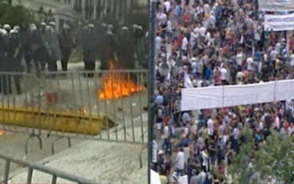 Διαδηλωτές εναντίον κουκουλοφόρων