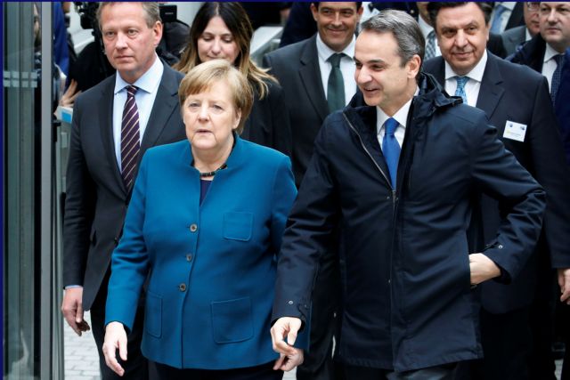 Mitsotakis courts investors in Berlin, holds talks on migration crisis, Turkey with Merkel