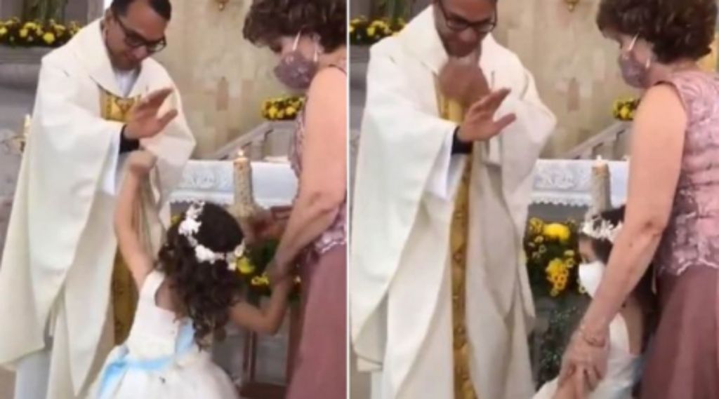 Viral στιγμή που ένας ιερέας πάει να ευλογήσει κοριτσάκι και εκείνο αντιδρά…. αυθόρμητα