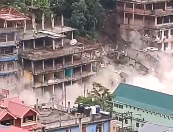 India: Shocking video of buildings collapsing like playing cards – fears for those stranded after massive landslide