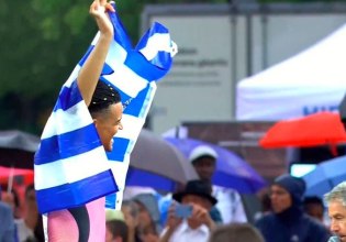 Ο Καραλής πανηγύρισε κάνοντας τον γύρο του θριάμβου με την ελληνική σημαία στους ώμους (vid)